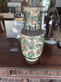 A pair of Chinese Nanking crackle glazed famille verte 'warrior' vases, 19th C.