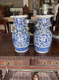Two Chinese blue and white 'lotus scroll' vases with relief design, 19th C.