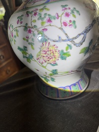 A pair of Chinese famille rose vases and covers with birds among blossoming branches, 19th C.