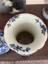 Two Chinese blue and white 'lotus scroll' vases with relief design, 19th C.