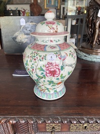 A pair of Chinese famille rose vases and covers with birds among blossoming branches, 19th C.