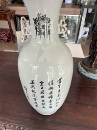A pair of Chinese famille rose 'animated palace scene' vases, 19th/20th C.