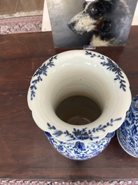 Two Chinese blue and white 'lotus scroll' vases with relief design, 19th C.