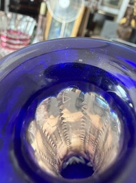 A varied collection of mainly partly coloured overlay cut crystal, a.o. Val Saint Lambert and Atlantis, 20th C.