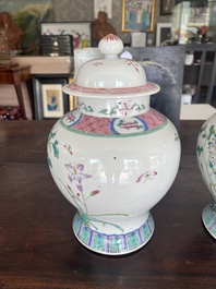 A pair of Chinese famille rose vases and covers with birds among blossoming branches, 19th C.