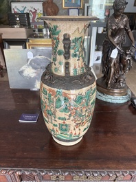 A pair of Chinese Nanking crackle glazed famille verte 'warrior' vases, 19th C.
