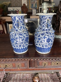 Two Chinese blue and white 'lotus scroll' vases with relief design, 19th C.