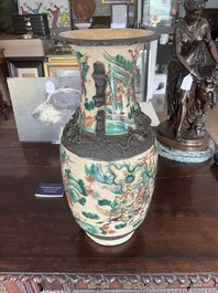 A pair of Chinese Nanking crackle glazed famille verte 'warrior' vases, 19th C.
