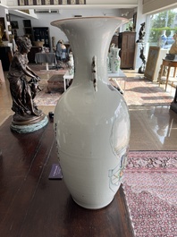 A pair of Chinese famille rose 'animated palace scene' vases, 19th/20th C.