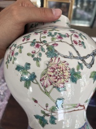 A pair of Chinese famille rose vases and covers with birds among blossoming branches, 19th C.