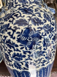 Two Chinese blue and white 'lotus scroll' vases with relief design, 19th C.