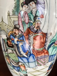 A pair of Chinese famille rose 'animated palace scene' vases, 19th/20th C.