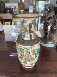 A pair of Chinese Nanking crackle glazed famille verte 'warrior' vases, 19th C.