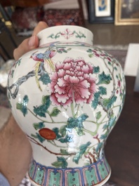 A pair of Chinese famille rose vases and covers with birds among blossoming branches, 19th C.