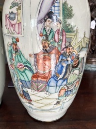 A pair of Chinese famille rose 'animated palace scene' vases, 19th/20th C.