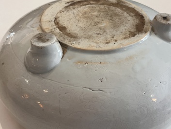 A Chinese monochrome white tripod censer with underglaze design, 19th C.