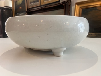 A Chinese monochrome white tripod censer with underglaze design, 19th C.