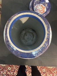 A pair of large Chinese famille rose blue-ground 'dragons and phoenixes' vases and covers, Kangxi mark, 19th C.