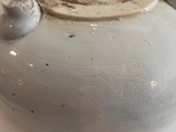 A Chinese monochrome white tripod censer with underglaze design, 19th C.
