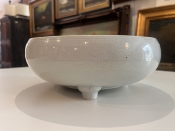 A Chinese monochrome white tripod censer with underglaze design, 19th C.