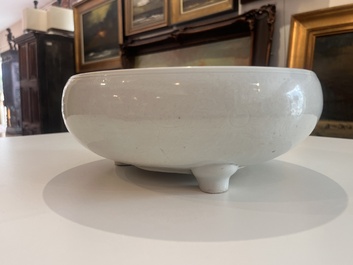 A Chinese monochrome white tripod censer with underglaze design, 19th C.
