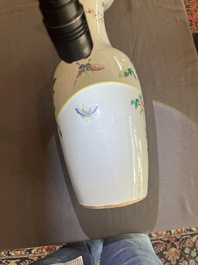 A Chinese famille rose vase with a pheasant and butterflies among blossoming branches, 19th C.