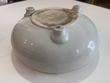 A Chinese monochrome white tripod censer with underglaze design, 19th C.