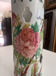 A Chinese reticulated qianjiang cai hatstand with birds among blossoming branches and two famille rose vases with animated design, 19th/20th C.