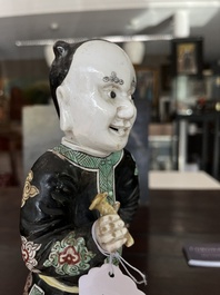 A Chinese famille noire 'soldier' figure, Kangxi