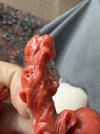 A Chinese red coral group with the 'Star God' Shou Xing and a lady, 19th/20th C.