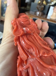 A Chinese red coral group with the 'Star God' Shou Xing and a lady, 19th/20th C.