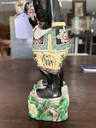 A Chinese famille noire 'soldier' figure, Kangxi