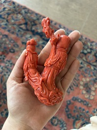 A Chinese red coral group with the 'Star God' Shou Xing and a lady, 19th/20th C.