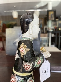 A Chinese famille noire 'soldier' figure, Kangxi