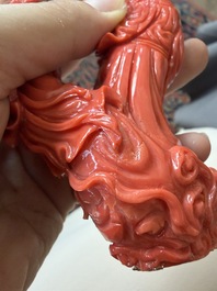 A Chinese red coral group with the 'Star God' Shou Xing and a lady, 19th/20th C.