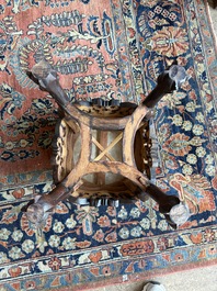 A Chinese openworked carved wooden stand with marble top, 19th/20th C.