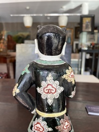 A Chinese famille noire 'soldier' figure, Kangxi