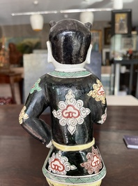 A Chinese famille noire 'soldier' figure, Kangxi