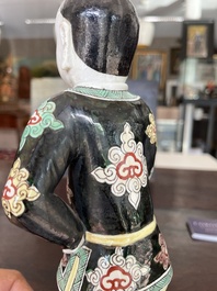 A Chinese famille noire 'soldier' figure, Kangxi