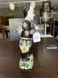 A Chinese famille noire 'soldier' figure, Kangxi