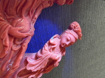 A Chinese red coral group with the 'Star God' Shou Xing and a lady, 19th/20th C.