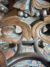A Chinese openworked carved wooden stand with marble top, 19th/20th C.