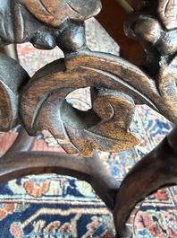 A Chinese openworked carved wooden stand with marble top, 19th/20th C.