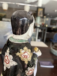 A Chinese famille noire 'soldier' figure, Kangxi
