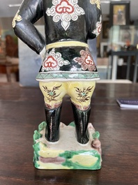 A Chinese famille noire 'soldier' figure, Kangxi