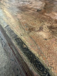 A Chinese rectangular carved and lacquered wooden low table with peach design, Qing