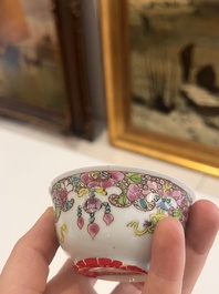 Six Chinese famille rose and gilt cups and saucers and a cream jug with floral and mandarin design, Yongzheng/Qianlong