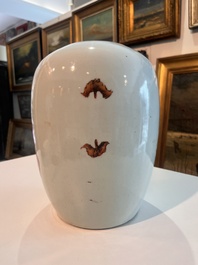 A pair of Chinese qianjiang cai jars and covers with ladies and children in a palace garden, 19th/20th C.