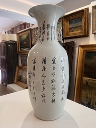 Two Chinese famille rose vases with ladies and children in a palace garden, 19th/20th C.