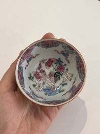 Six Chinese famille rose and gilt cups and saucers and a cream jug with floral and mandarin design, Yongzheng/Qianlong